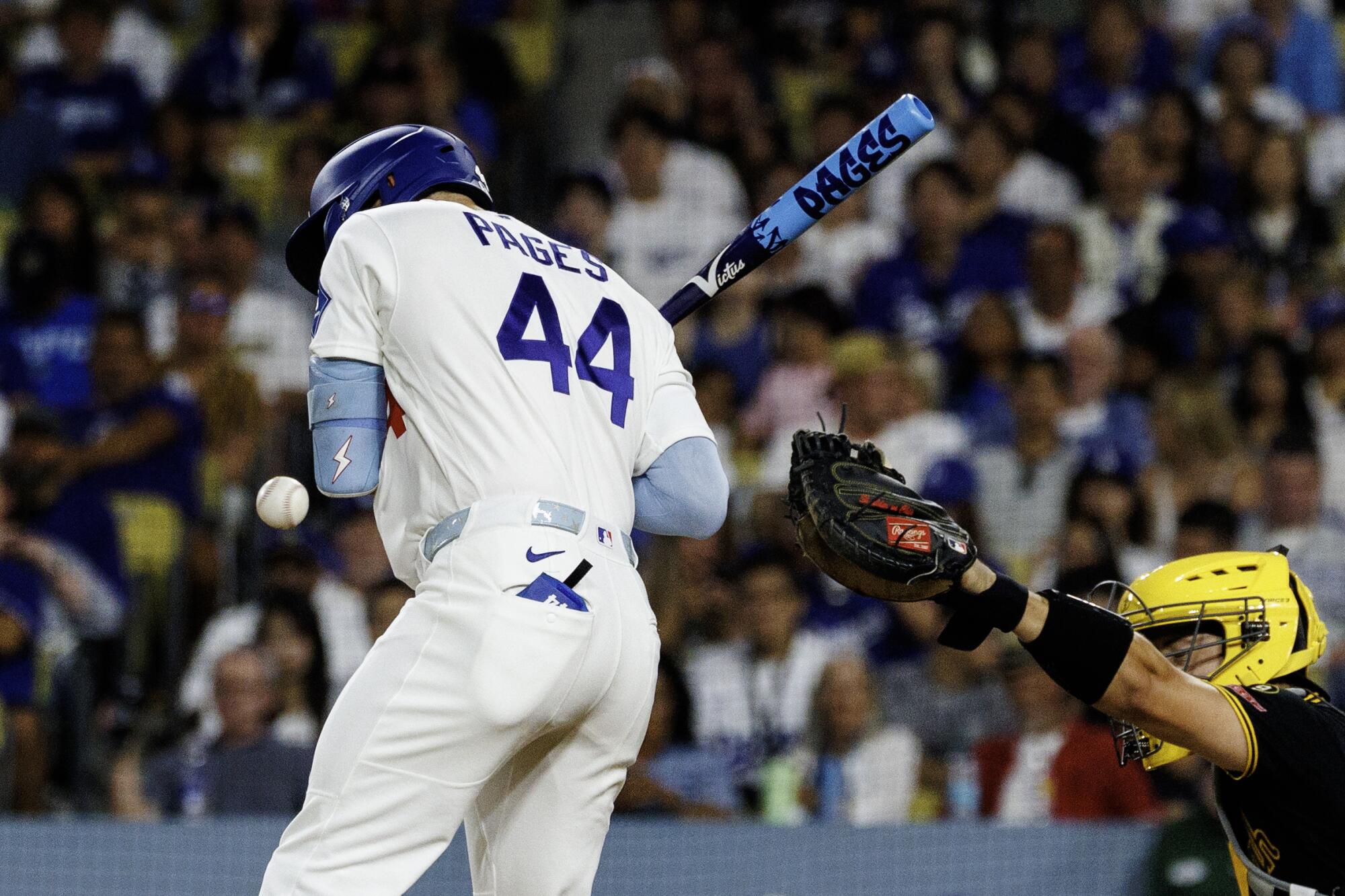 Dodgers center fielder Andy Pages gets hit by a pitch during the third inning against the Pirates on Friday night.