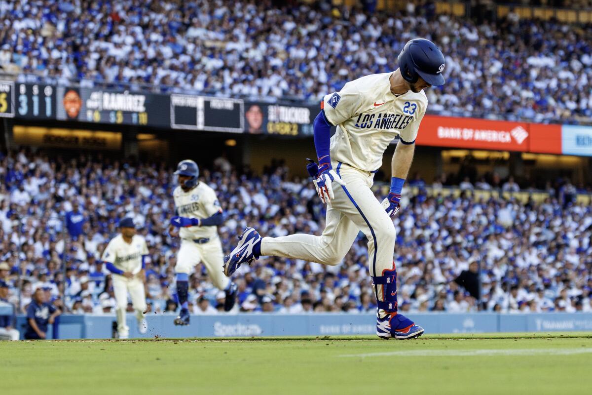 Kyle Tucker runs to first base after hitting a go-ahead, two-run single against the Pirates in the fifth inning Saturday.