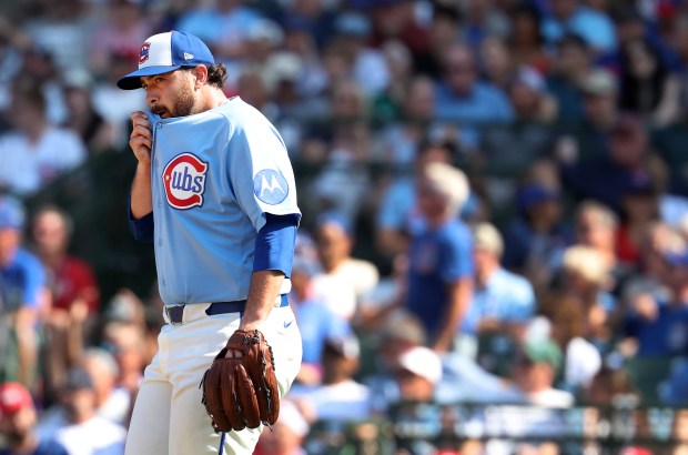 Cubs reliever Aaron Civale walks back to the mound after giving up a two-run single to Reds shortstop Elly de la Cruz in the seventh inning Aug. 28, 2026, at Wrigley Field. (Chris Sweda/Chicago Tribune)