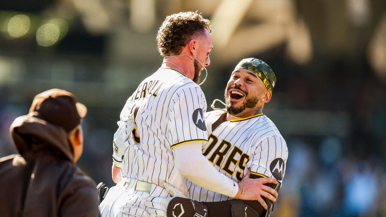 Padres rally in extras to sweep Brewers and hold onto playoff spot
