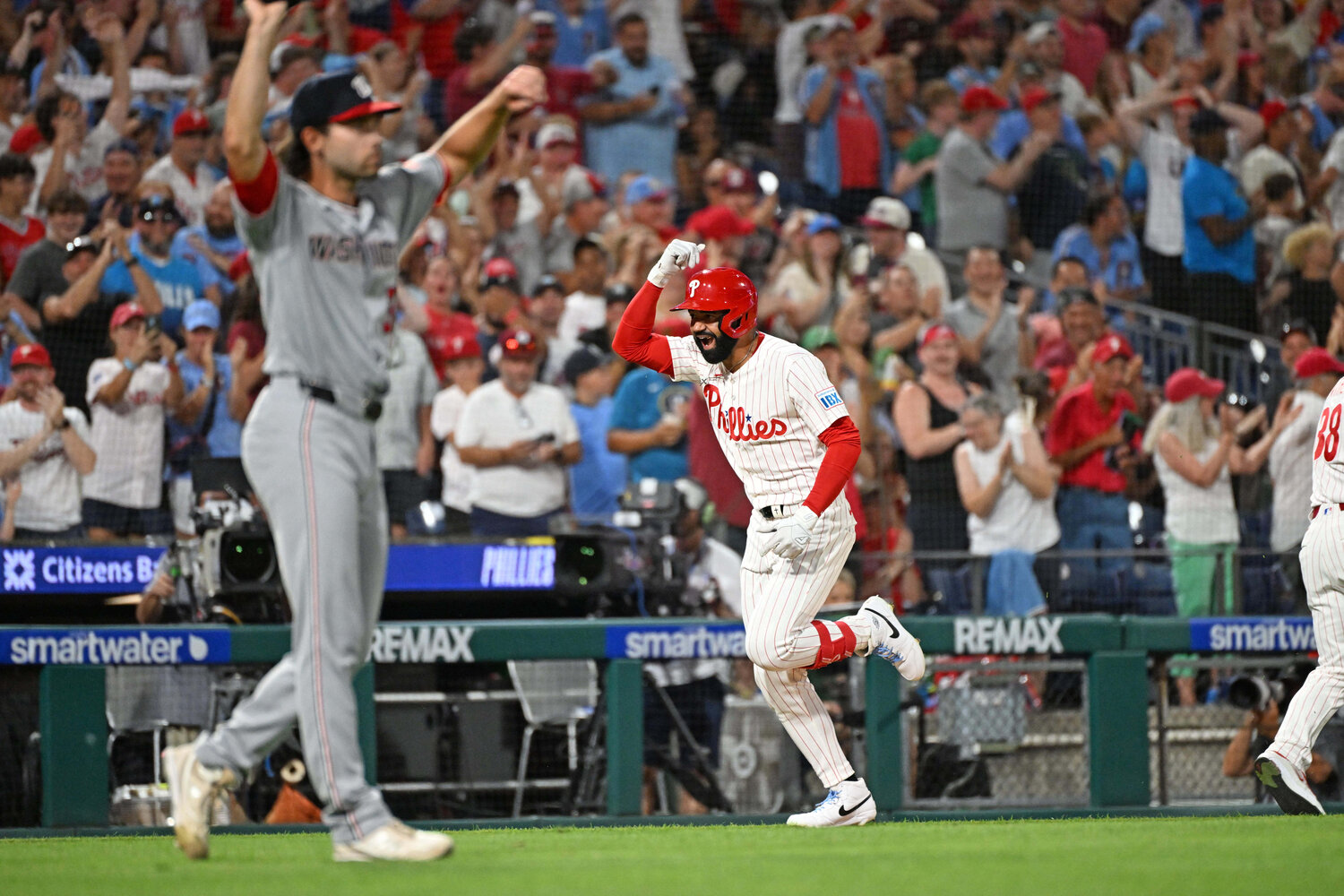 Philadelphia Phillies right fielder Derek Hill (49) celebrates after hitting a grand slam during the seventh inning against the Washington Nationals pitcher Tom Cosgrove (34) at Citizens Bank Park.