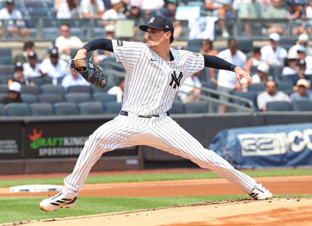 New York Yankees pitcher Nestor Cortes Jr. throwing a pitch during a game against the Seattle Mariners.