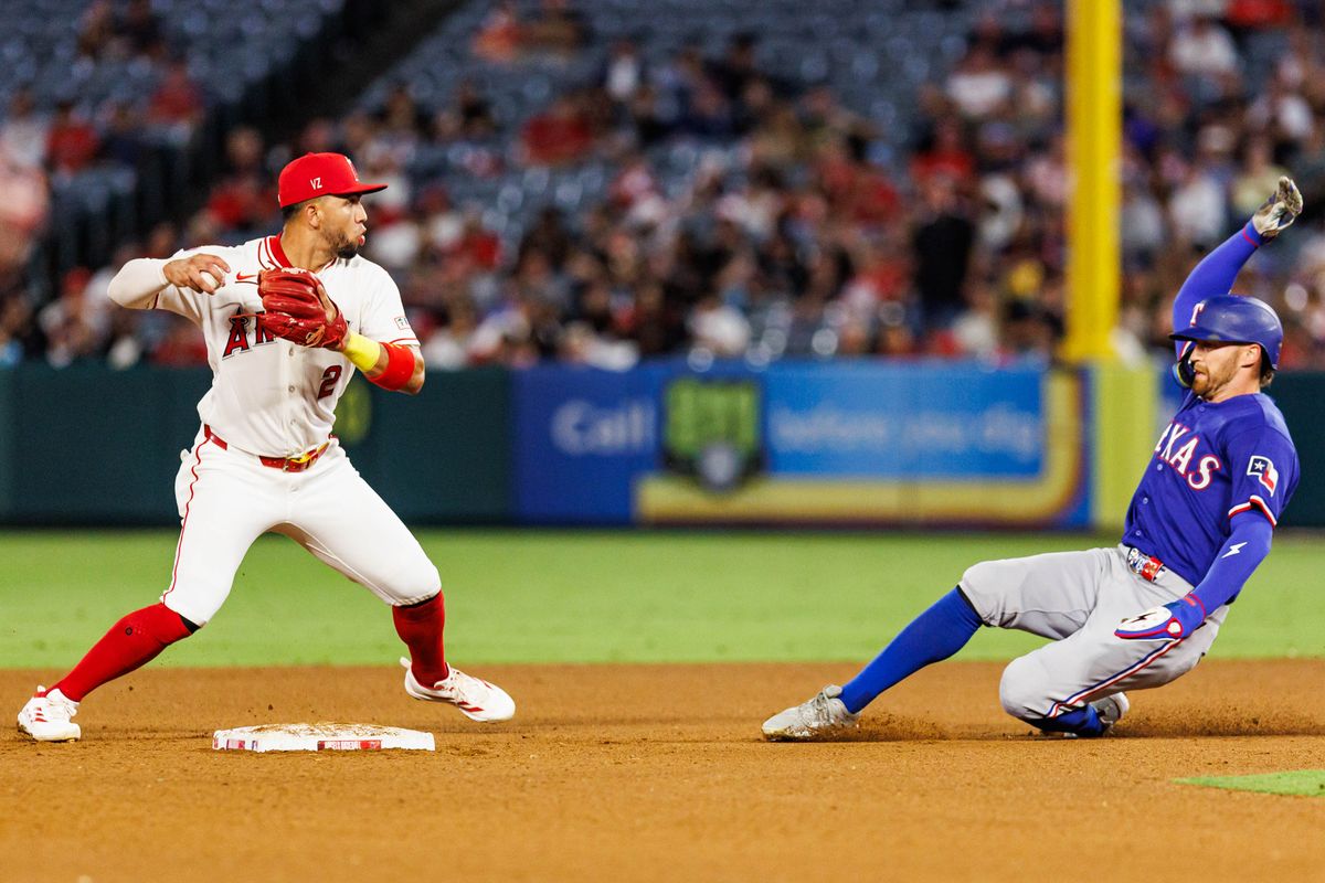 Oswald Peraza #2 of the Los Angeles Angels attempts to complete the double play during an MLB game against the Texas Rangers on August 12, 2026 at Angel Stadium in Anaheim, California. Oswald Peraza #2 of the Los Angeles Angels attempts to complete the double play during an MLB game against the Texas Rangers on August 12, 2026 at Angel Stadium in Anaheim, California.