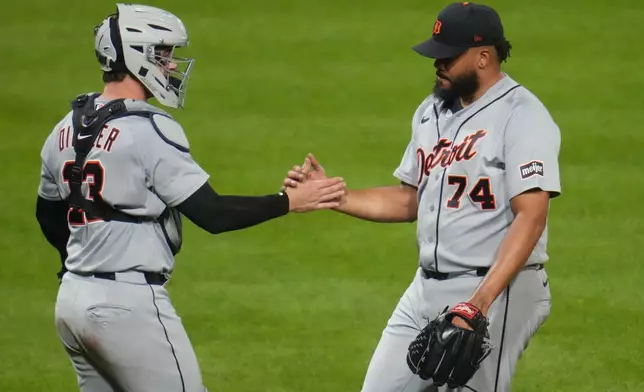 Detroit Tigers pitcher Kenley Jansen (74) celebrates with catcher Dillon Dingler, left, after getting the final out of a baseball game against the Pittsburgh Pirates in Pittsburgh, Monday, Aug. 17, 2026. (AP Photo/Gene J. Puskar)