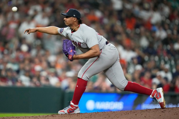 Boston Red Sox pitcher Johan Oviedo throws during the fifth inning of a baseball game against the Houston Astros in Houston, Monday, March 30, 2026. (AP Photo/Ashley Landis)