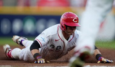 Cincinnati Reds' TJ Friedl dives into third base for a triple to score Jose Trevino during the second inning of a baseball game against the Baltimore Orioles in Cincinnati, Saturday, July 4, 2026. (AP Photo/Carolyn Kaster)