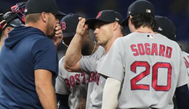 Boston Red Sox starting pitcher Sonny Gray, center, talks on the mound during the second inning of a baseball game against the Miami Marlins, Wednesday, Aug. 26, 2026, in Miami. (AP Photo/Lynne Sladky)