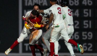 Caleb Durbin gets mobbed by teammates after delivering a walkoff single Thursday night as the Red Sox improved to 31-5 in their last 36 games.