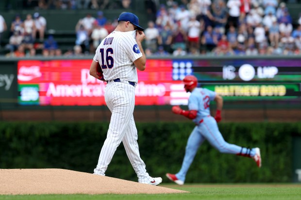 Cubs starter Matthew Boyd walks off the mound as Cardinals left fielder Joshua Báez rounds the bases after hitting a two-run home run in the first inning Saturday, Aug. 15, 2026, at Wrigley Field. (Chris Sweda/Chicago Tribune)