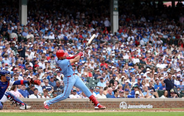 St. Louis Cardinals left fielder Joshua Báez (22) hits a two-run home run in the sixth inning of a game against the Chicago Cubs at Wrigley Field in Chicago on Aug. 15, 2026. (Chris Sweda/Chicago Tribune)