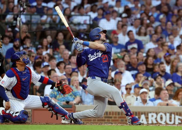 Los Angeles Dodgers right fielder Kyle Tucker (23) hits a solo home run in the second inning of a game against the Chicago Cubs at Wrigley Field in Chicago on Aug. 4, 2026. (Chris Sweda/Chicago Tribune)