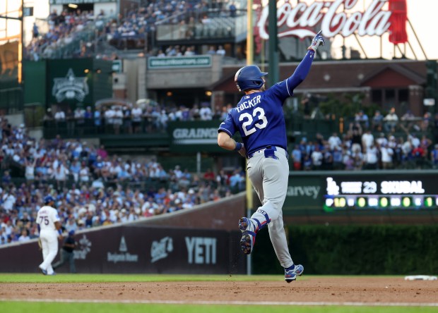 Los Angeles Dodgers right fielder Kyle Tucker (23) rounds the bases after hitting a solo home run in the second inning of a game against the Chicago Cubs at Wrigley Field in Chicago on Aug. 4, 2026. (Chris Sweda/Chicago Tribune)