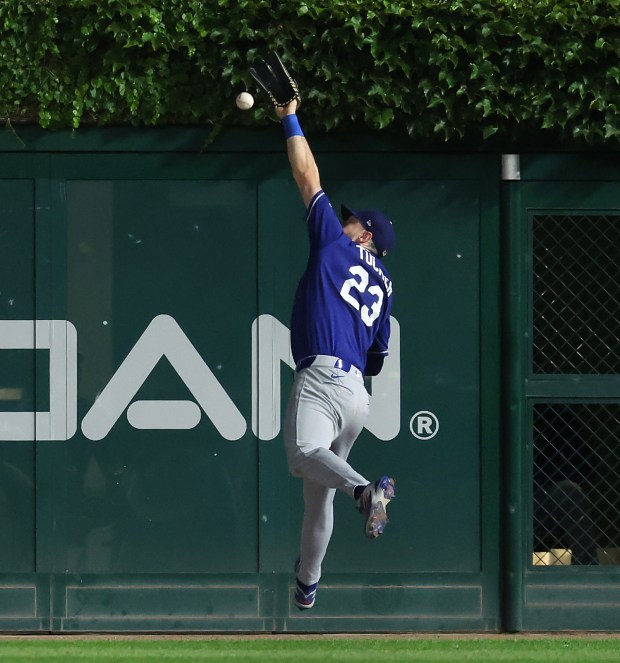 Los Angeles Dodgers right fielder Kyle Tucker (23) is unable to catch a ball that went for a double for Chicago Cubs third baseman Alex Bregman in the sixth inning of a game at Wrigley Field in Chicago on Aug. 4, 2026. (Chris Sweda/Chicago Tribune)