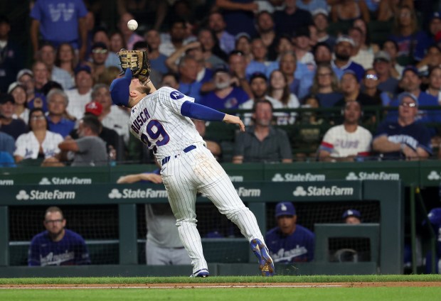 Chicago Cubs first baseman Michael Busch (29) catches a foul pop in the seventh inning of a game against the Los Angeles Dodgers at Wrigley Field in Chicago on Aug. 4, 2026. (Chris Sweda/Chicago Tribune)