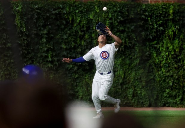 Chicago Cubs left fielder Tyrone Taylor catches a fly ball in the eighth inning of a game against the Los Angeles Dodgers at Wrigley Field in Chicago on Aug. 4, 2026. (Chris Sweda/Chicago Tribune)
