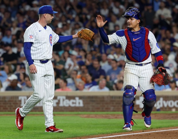 Chicago Cubs relief pitcher Ryan Zeferjahn and catcher Miguel Amaya (9) congratulate one another after shutting down the Los Angeles Dodgers in the eighth inning of a game at Wrigley Field in Chicago on Aug. 4, 2026. (Chris Sweda/Chicago Tribune)