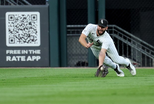 Chicago White Sox left fielder Tristan Peters (29) catches a ball that went for a single for Texas Rangers center fielder Evan Carter in the second inning of a game at Rate Field in Chicago on Aug. 26, 2026. (Chris Sweda/Chicago Tribune)