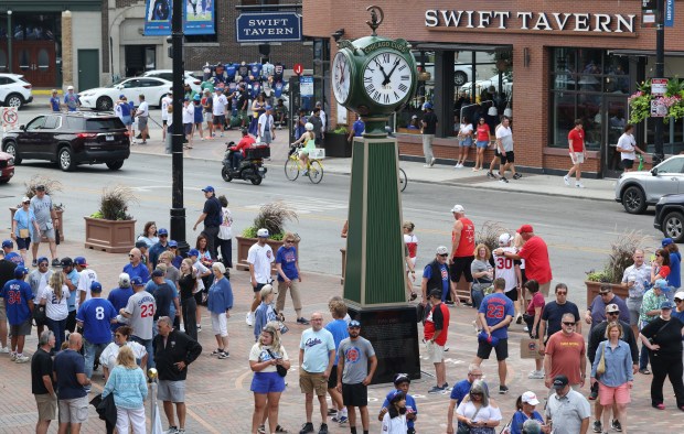 The Chicago Cubs Founders' Clock is on display as fans walk about before a Cubs-Reds game at Wrigley Field on Aug. 29, 2026, in Chicago. (John J. Kim/Chicago Tribune)