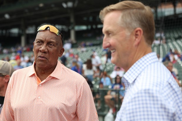 Former Cubs player Fergie Jenkins, left, talks with colleagues before a Cubs-Reds game at Wrigley Field on Aug. 29, 2026, in Chicago. (John J. Kim/Chicago Tribune)