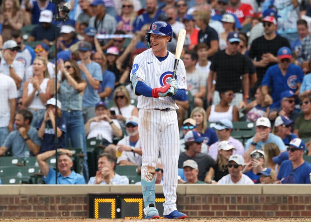 Cubs center fielder Pete Crow-Armstrong smiles as he comes to the plate against Reds catcher Jose Trevino, who took the mound in the eighth inning at Wrigley Field on Aug. 29, 2026, in Chicago. (John J. Kim/Chicago Tribune)