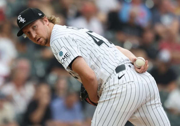 White Sox pitcher Erick Fedde looks at first base while throwing against the Reds in the third inning at Rate Field on Aug. 13, 2026, in Chicago. (John J. Kim/Chicago Tribune)