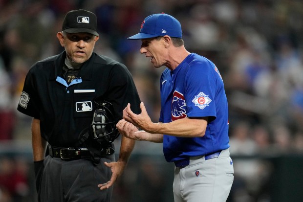 Cubs manager Craig Counsell, right, argues with plate umpire Alfonso Márquez in the sixth inning of a game against the Diamondbacks on Wednesday, Aug. 26, 2026, in Phoenix. (Ross D. Franklin/AP)
