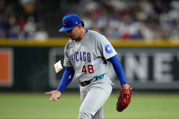 Cubs reliever Daniel Palencia flips the rosin bag during the eighth inning against the Diamondbacks on Tuesday, Aug. 25, 2026, in Phoenix. (Ross D. Franklin/AP)