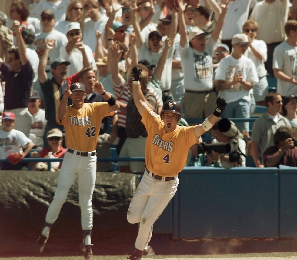 Louisiana State's Warren Morris (4) starts to celebrate as he rounds first base in front of...
