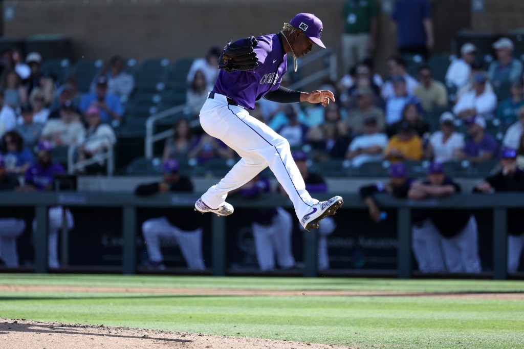 Jefry Yan #67 of the Colorado Rockies celebrates during the game against the Seattle Mariners