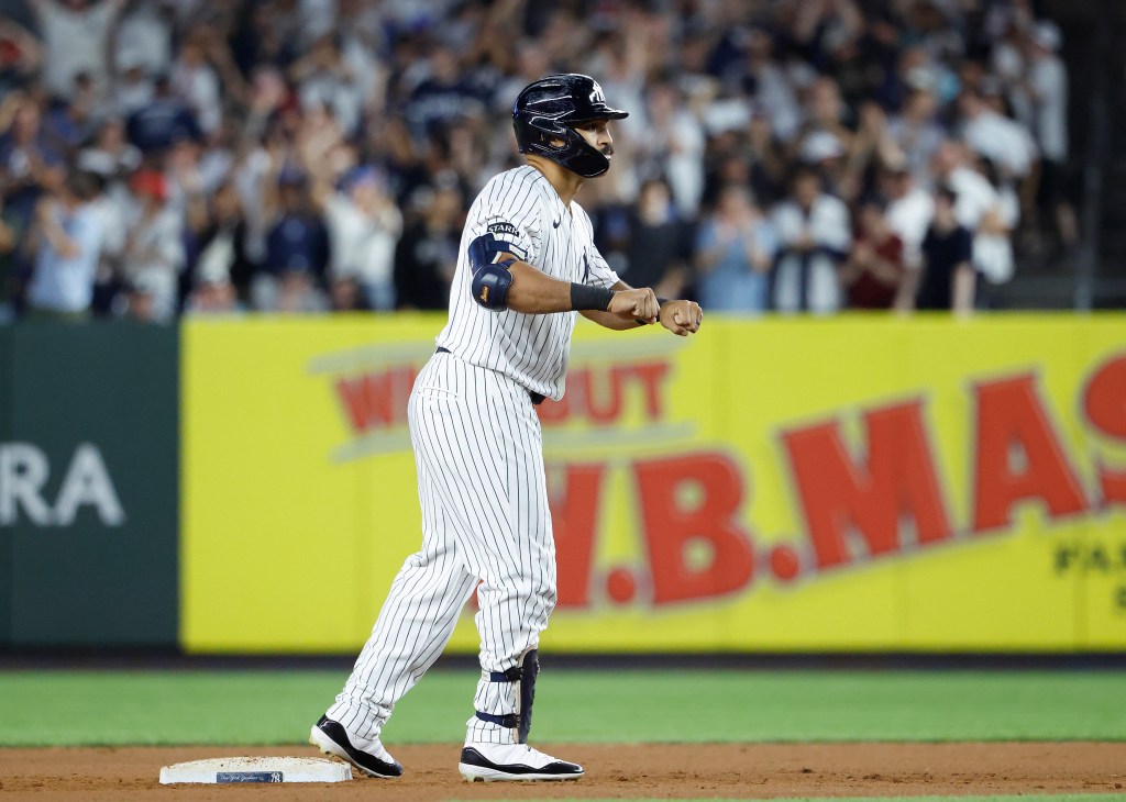  New York Yankees center fielder Trent Grisham reacts after he hits an RBI double