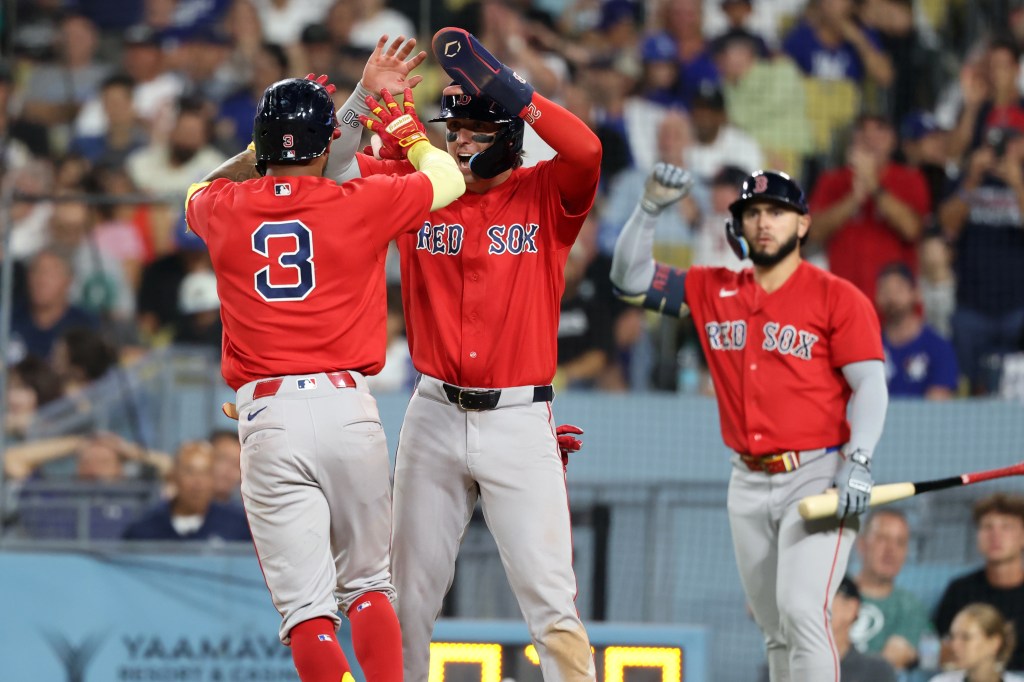 Boston Red Sox center fielder Ceddanne Rafaela (3) celebrates with second baseman Nick Sogard (20) after hitting a two-run home run.