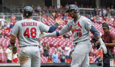 Dropped fly with 2 outs in 9th helps Cardinals to wild 10-9 win over Reds