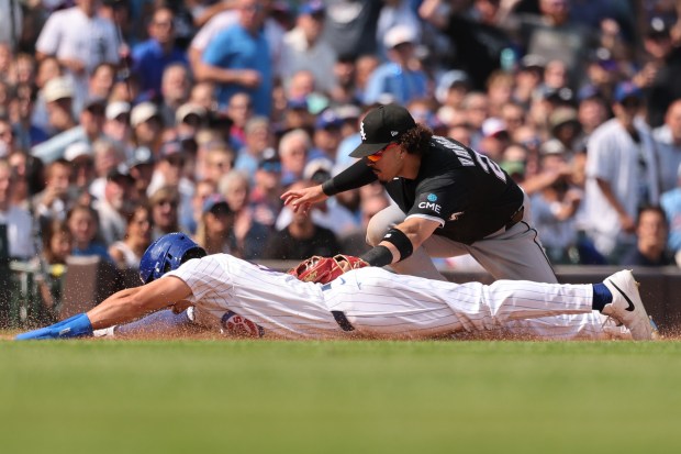 Miguel Vargas of the Chicago White Sox tags out Tyrone Taylor of the Chicago Cubs after trying to advance to third base during the sixth inning at Wrigley Field on Aug. 19, 2026 in Chicago. (Michael Reaves/Getty Images)