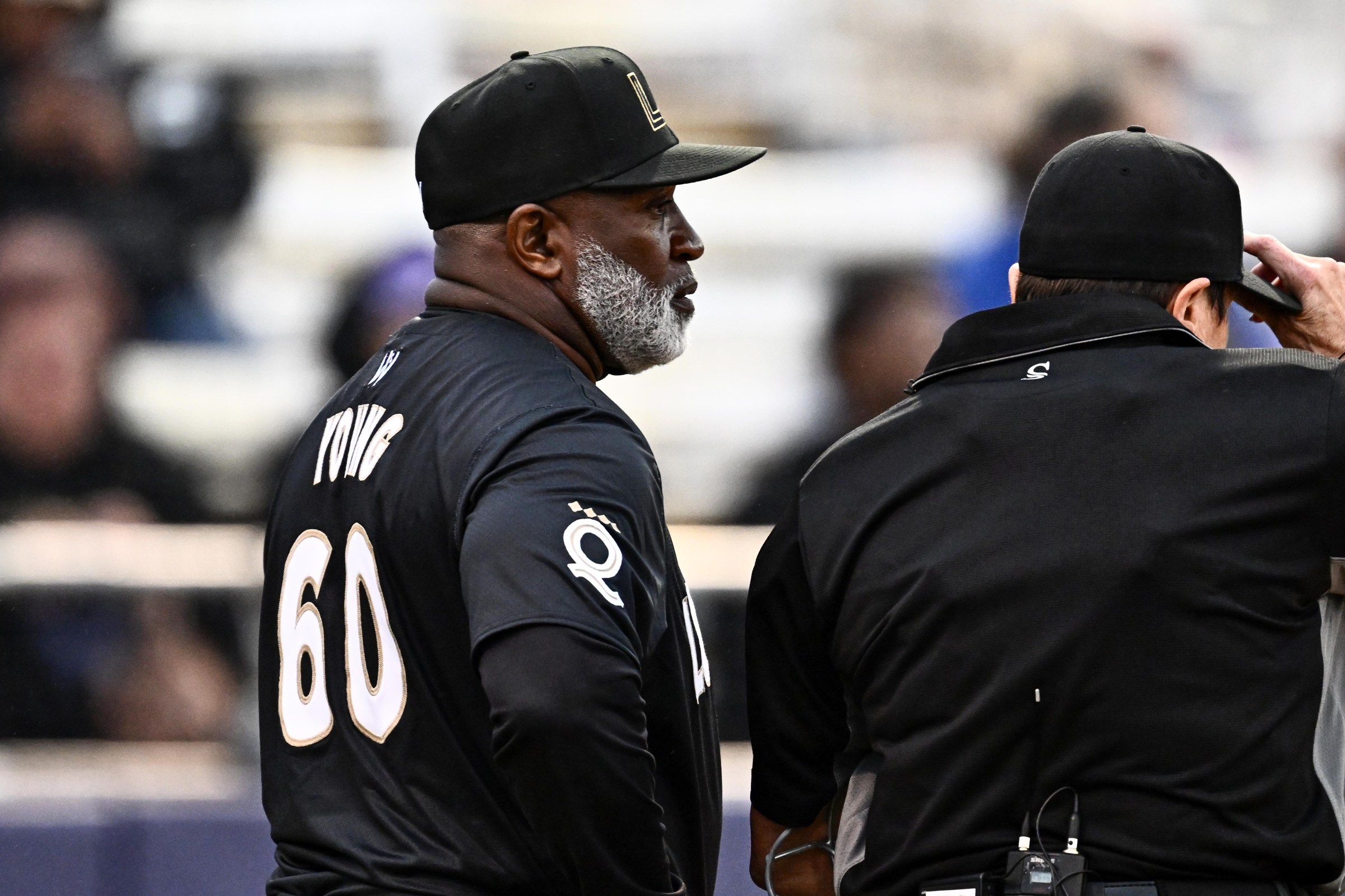 SPRINGFIELD, ILLINOIS - AUGUST 01, 2026: Manager Eric Young of the Los Angeles Queens talks with home plate umpire Kelly Dine during the third inning of the Women’s Pro Baseball League Opening Day game against the New York Heights at Robin Roberts Field on August 01, 2026 in Springfield, Illinois. (Photo by Chris Bernacchi/Diamond Images via Getty Images)