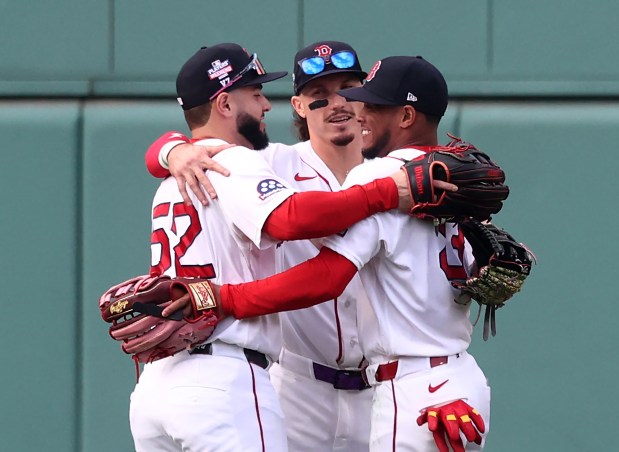 Boston Red Sox's Wilyer Abreu, left, Jarren Duran. middle and Ceddanne Rafaela celebrate the win over the San Francisco Giants at Fenway Park. (Nancy Lane/Boston Herald)