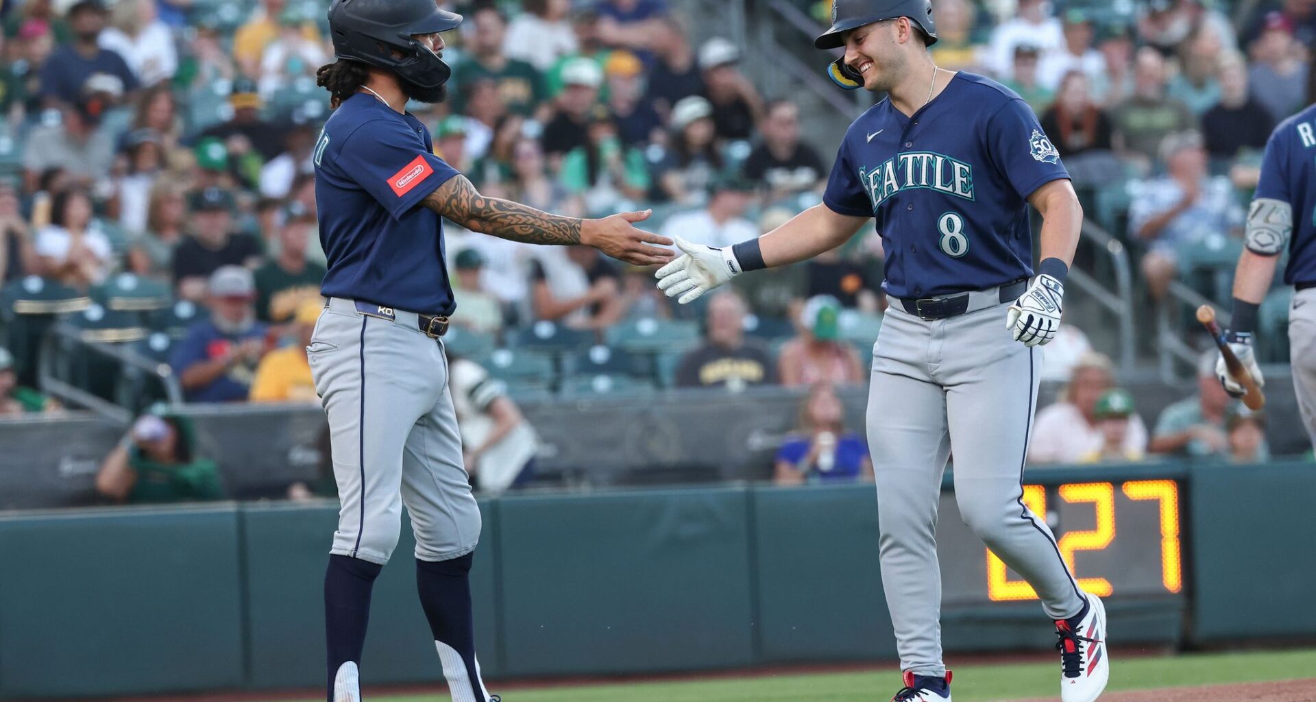 Mariners pound Athletics 19-1 with 5 home runs, 23 hits