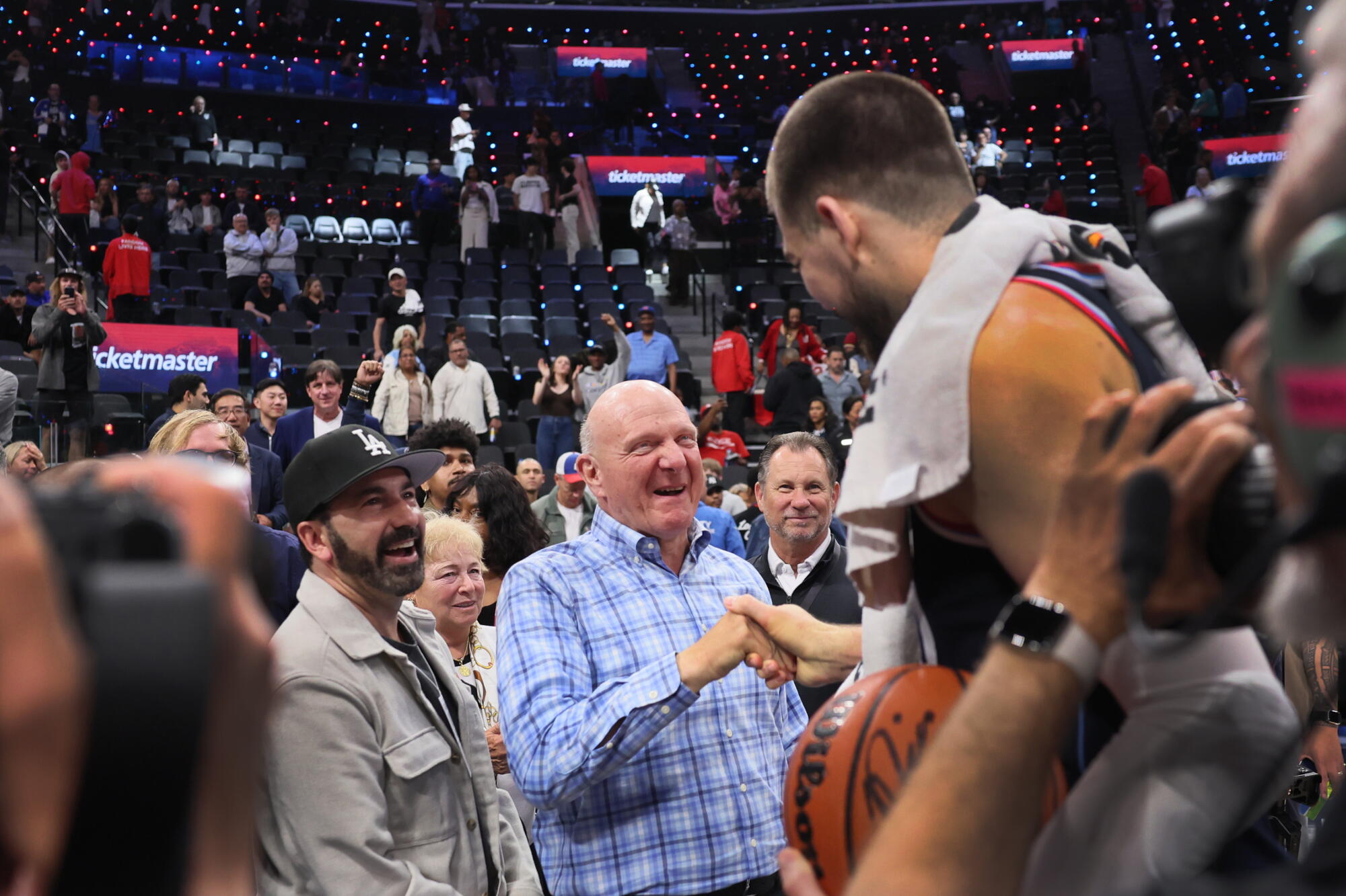 Clippers owner Steve Ballmer congratulates center Ivica Zubac after he earned his first career triple-double