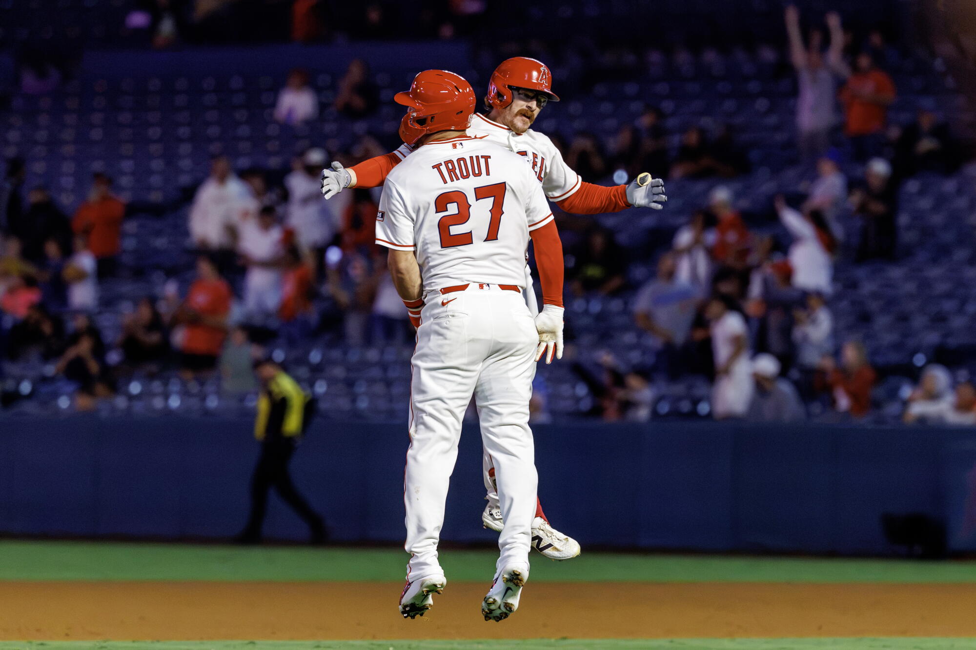 Wade Meckler celebrates with Mike Trout after hitting a walk-off single in the 10th inning of the Angels' 5-4 win.