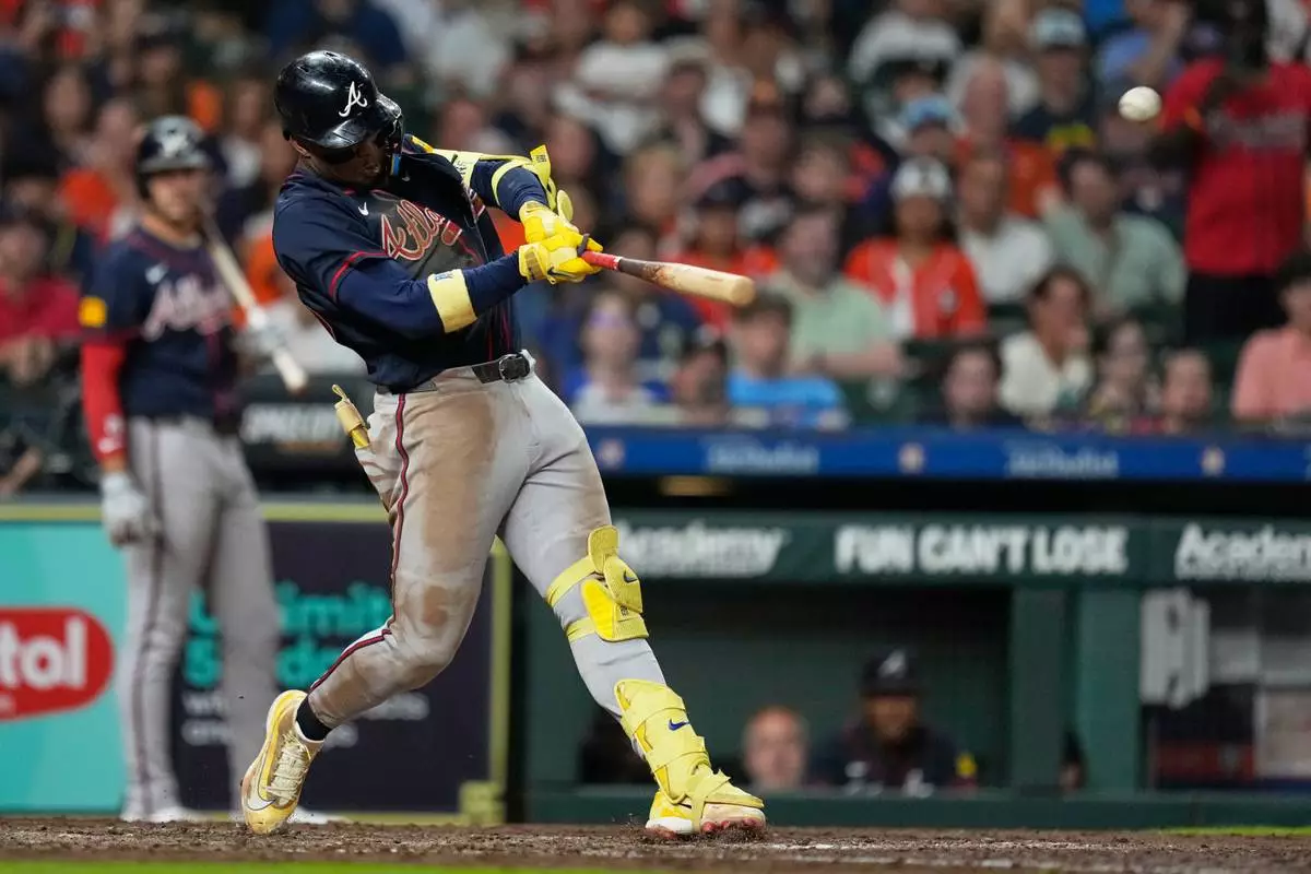 Atlanta Braves' Ronald Acuña Jr. hits a grand slam during the seventh inning of a baseball game against the Houston Astros in Houston, Saturday, Sept. 19, 2026. (AP Photo/Ashley Landis)