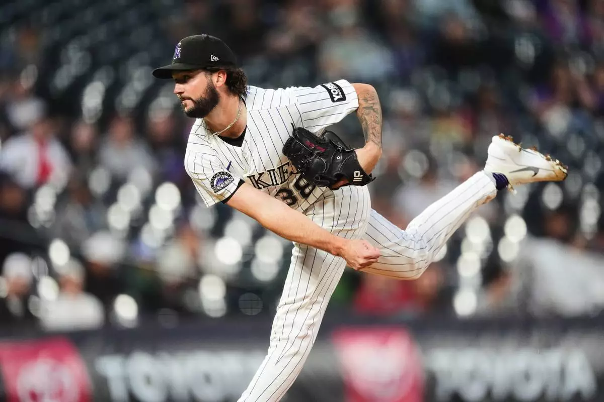 Colorado Rockies starting pitcher Mason Adams works against the Arizona Diamondbacks in the first inning of a baseball game Wednesday, Sept. 23, 2026, in Denver. (AP Photo/David Zalubowski)