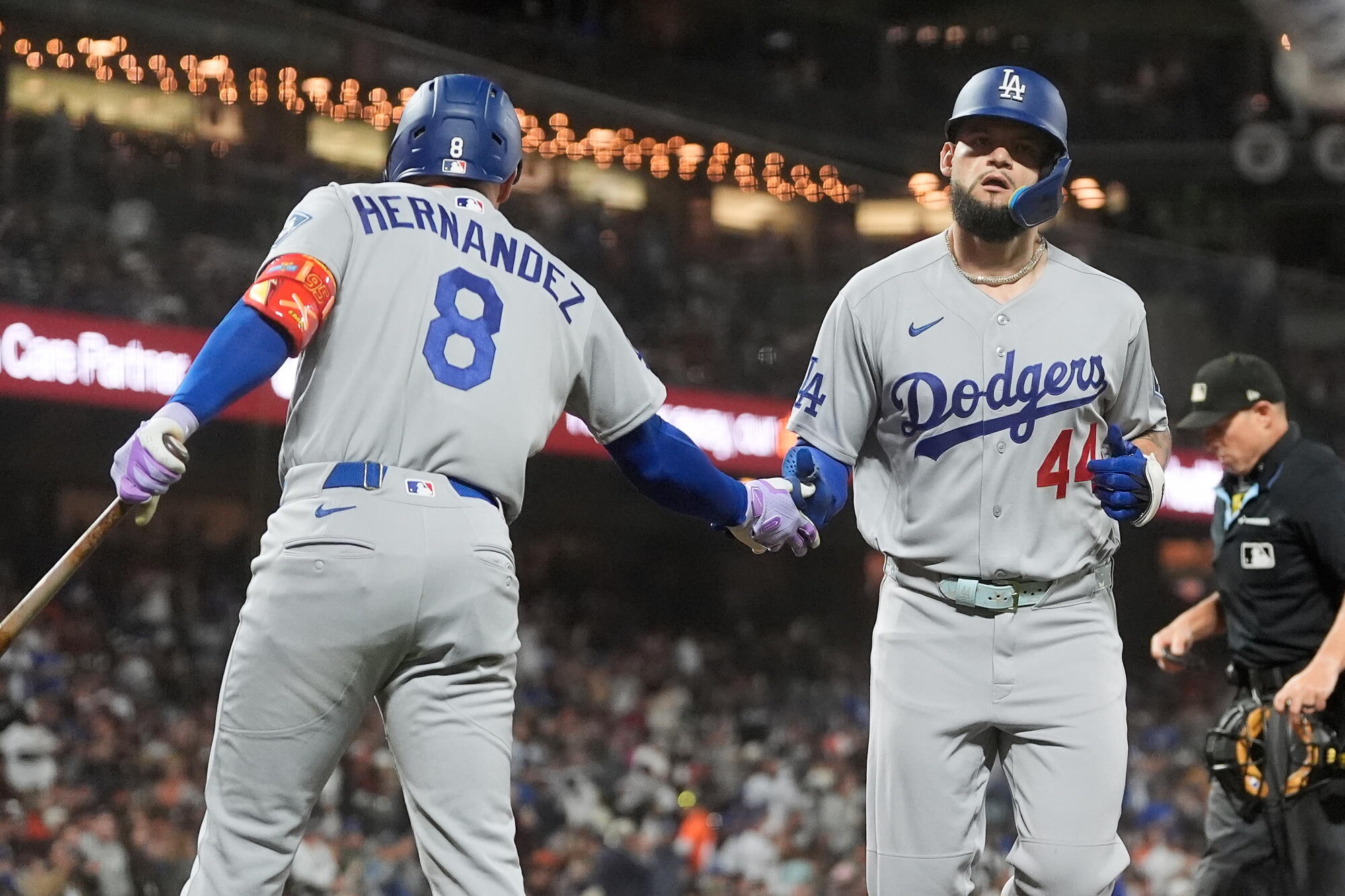 Andy Pages, right, is congratulated by Dodgers teammate Kiké Hernández after hitting a home run.