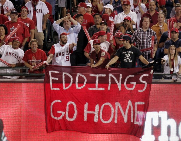 Angels fans unfurl a sign directed at umpire Doug Eddings during Game 3 of the American League Championship Series against the Chicago White Sox on Oct. 14, 2005, at Angel Stadium. Eddings made a controversial call against the Angels in Game 2 in Chicago. (AP Photo/Mark J. Terrill)
