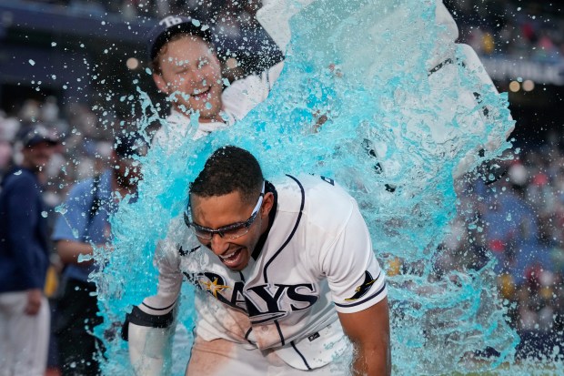 Tampa Bay Rays' Richie Palacios, front, gets doused by Taylor Walls after Palacios hit a walk off single off Boston Red Sox pitcher Garrett Whitlock during the ninth inning of a baseball game Saturday, Sept. 19, 2026, in St. Petersburg, Fla. (AP Photo/Chris O'Meara)