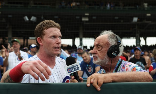 Cubs center fielder Pete Crow-Armstrong is interviewed by reporter Bruce Levine after a 3-2 win over the Blue Jays in 11 innings at Wrigley Field on Aug. 6, 2026. (John J. Kim/Chicago Tribune)