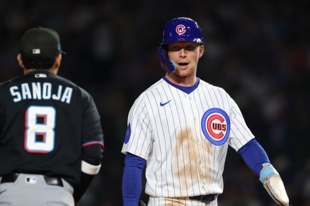 Cubs center fielder Pete Crow-Armstrong heads to the dugout after right fielder Seiya Suzuki strikes out to end the third inning against the Marlins at Wrigley Field on Sept. 22, 2026, in Chicago. Crow-Armstrong stole his 39th base of the season. (John J. Kim/Chicago Tribune)
