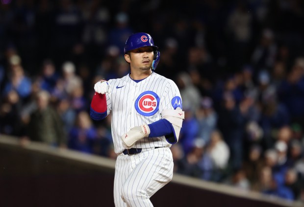 Cubs right fielder Seiya Suzuki gestures to teammates after hitting a double in the seventh inning against the Marlins at Wrigley Field on Sept. 22, 2026, in Chicago. (John J. Kim/Chicago Tribune)
