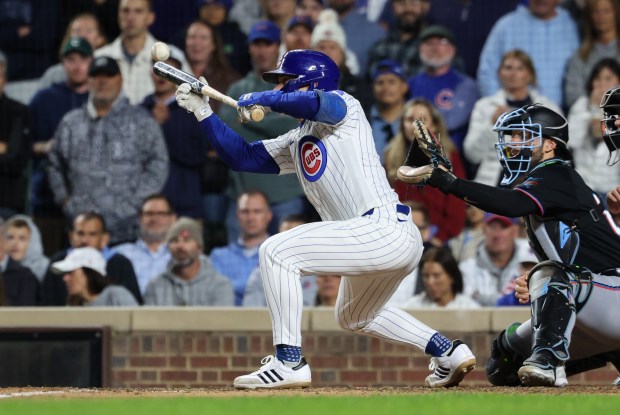 Cubs designated hitter Matt Shaw bunts a pop up for an out in tenth inning against the Marlins at Wrigley Field on Sept. 22, 2026, in Chicago. (John J. Kim/Chicago Tribune)