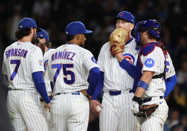 Cubs pitcher Ryan Zeferjahn covers his mouth before being taken out of the game in the 11th inning against the Marlins at Wrigley Field on Sept. 22, 2026, in Chicago. (John J. Kim/Chicago Tribune)