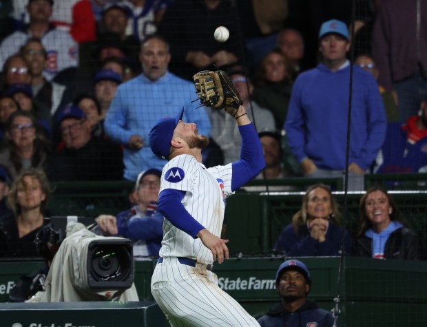 Cubs first baseman Michael Busch catches a pop up from Marlins catcher Joe Mack in the 11th inning at Wrigley Field on Sept. 22, 2026, in Chicago. (John J. Kim/Chicago Tribune)
