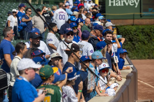 Fans wait to get autographs signed before a baseball game between the Pittsburgh Pirates and Chicago Cubs at Wrigley Field on Sunday, Sept. 13, 2026. (Arthur Maiorella/Chicago Tribune)